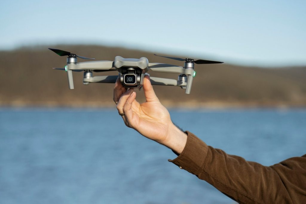 man s hand holding drone outdoors 23 2149392706.jpg 0 0x0